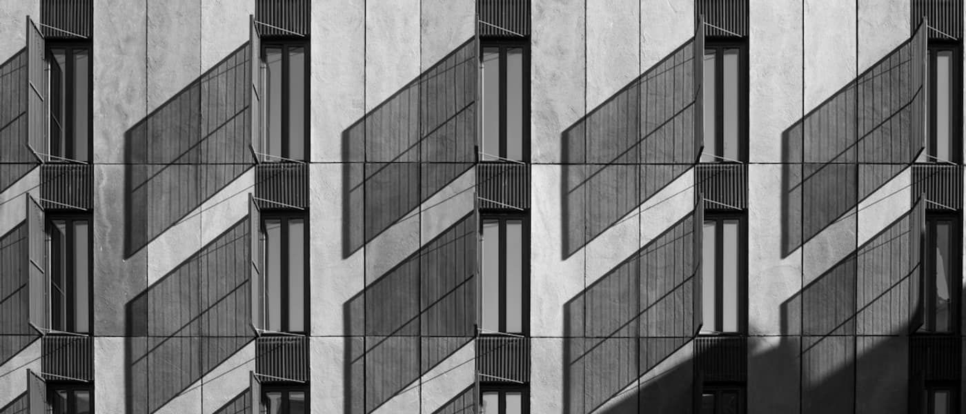 Repeating modular window grid on a concrete facade